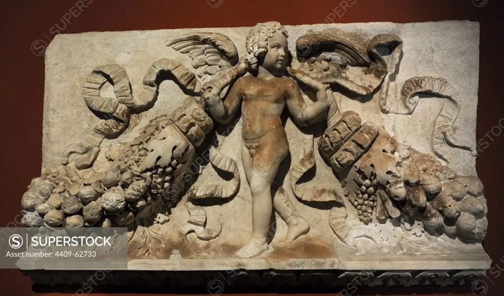 Fragment of a frieze with relief depicting Eros carrying garlands. 120 - 130 AD. Marble. From unknown building of Rome. Pergamon Museum. Berlin. Germany.