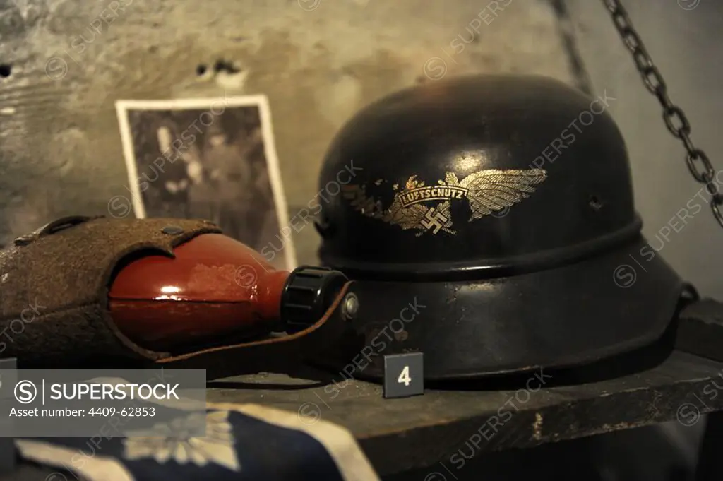 Canteen and helmet of the Luftschutz (protection and German air defense) with anti-aircraft swastika insignia. Property of Mhk. Museum of Oskar Schindler's Factory. Krakow. Poland.