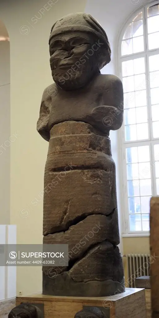 Hittite art. Colossal statue of the Weather God Hadad. Found in Gerdshin, near Sma'al /Zincirli (Turkey). Basalt. 775 BC. Pergamon Museum. Museum Island. Berlin. Germany.