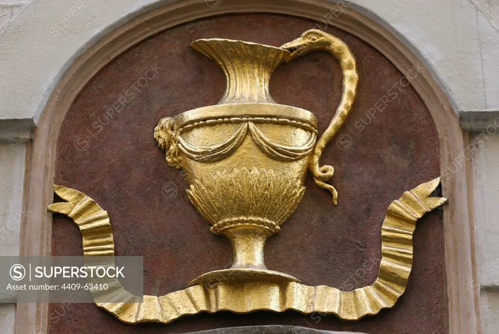 Prague, Czech Republic. Escutcheon on the facade of a building with depiction of a jug. "The Golden Jug" (U Zlate). Melantrichova Street. Old Town (Stare Mesto).