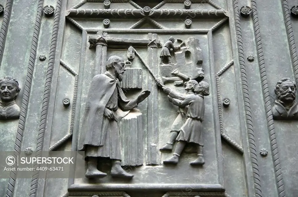 Czech Republic. Prague. St. Vitus Cathedral. Bronze door, made __in 1927 by Otakar Spaniel (1881-1955). Decorated with reliefs of building of the Cathedral.