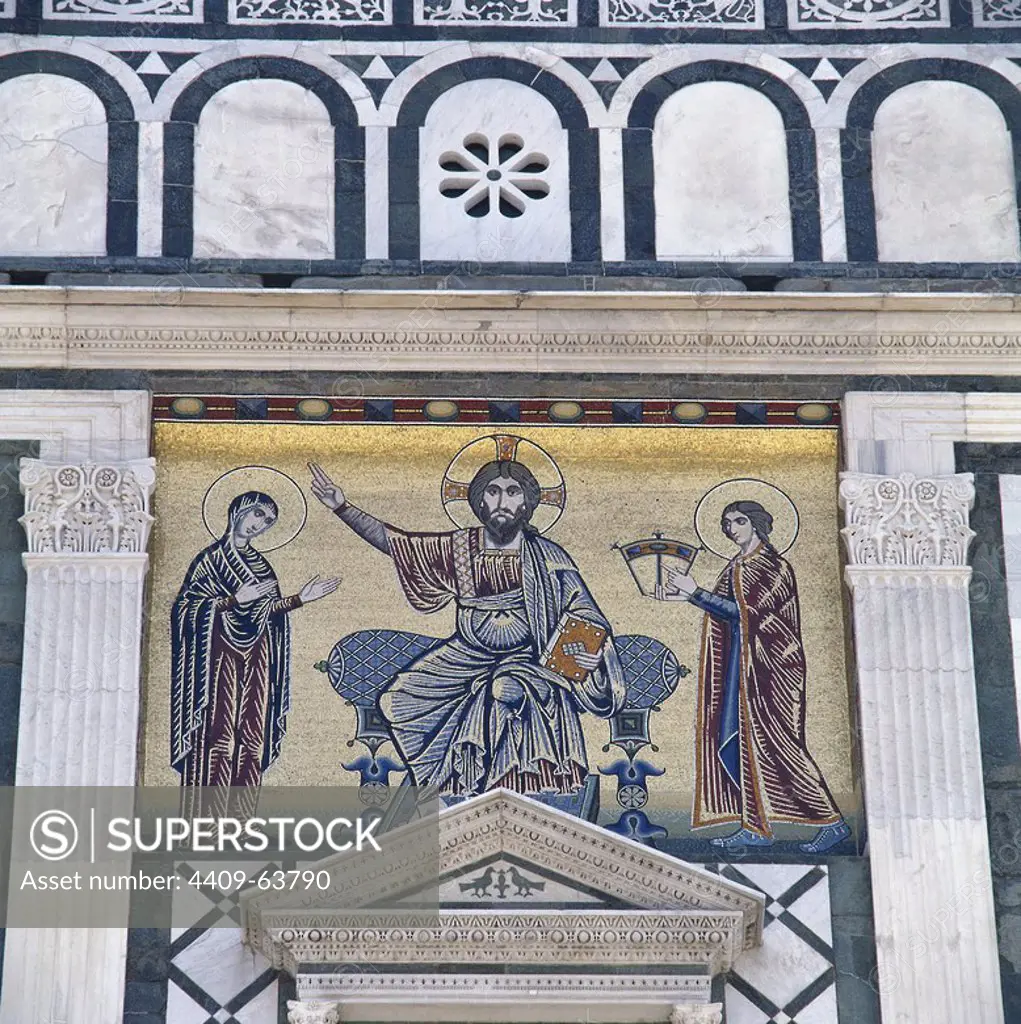 Italy. Florence. Basilica of San Miniato al Monte. Romanesque style. 11th century. Mosaic on the facade. Christ, the Virgin Mary and St. John. Tuscany.