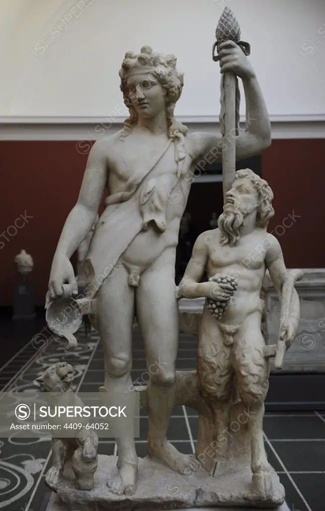 Bacchus (Roman) also known as Dionysus (Greek). God of the grape harvest in classical mythology. Statue of Bacchus with satyr and panther. From roman Villa of Pozzuoli, near Naples, Italy. 2nd century AD. Marble. Ny Carlsberg Glyptotek. Copenhagen, Denmark.