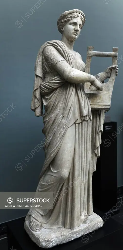 Classical mythology. Erato. Muse of lyric poetry. Roman statue. 2nd century AD. The muse is depicted playing the zither or lyre. From Monte Calvo, Italy. Ny Carlsberg Glyptotek. Copenhagen, Denmark.