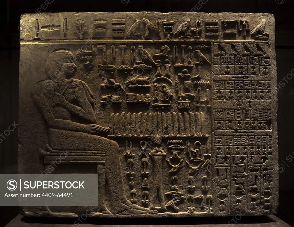 The official Isi at his offering Table. From the tomb of Isi Probably at Sakkara. Limestone. 4th Dynastry, c. 2570-2450 BC. Old Kingdom. Reliefs. Detail. Hieroglyphs. Ny Carlsberg Glyptotek. Copenhagen. Denmark.