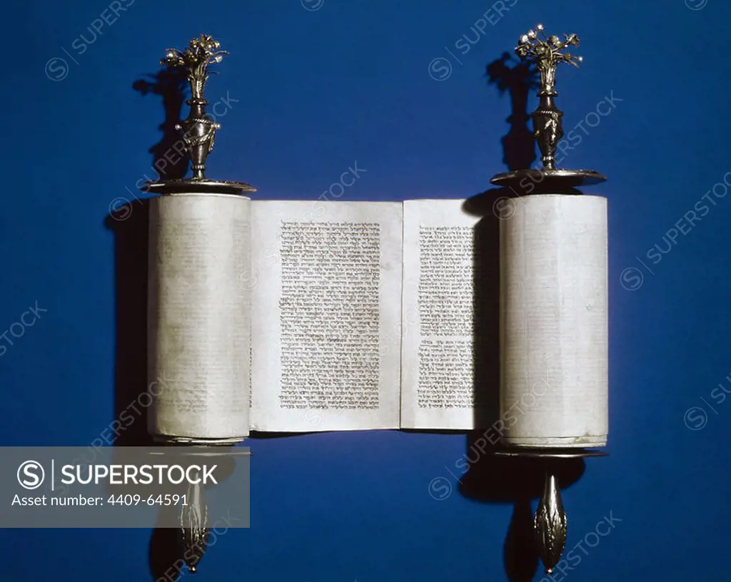 Judaism. Torah. Scroll of the Law and silver scroll holder.