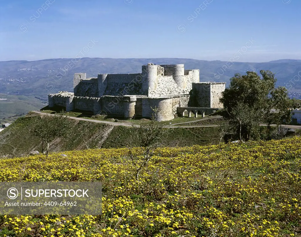 Syria. Krak des Chevaliers. Castle built in the 12th century by the Knights Hospitaller during the Crusades to the Holy Land. Panoramic view. Photo taken before Syrian Civil War.