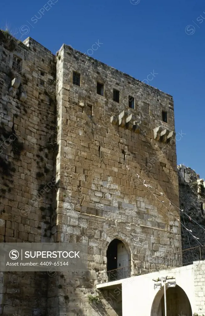 Syria. Talkalakh District, Krak des Chevaliers. Crusader castle, under control of Knights Hospitaller (1142-1271) during the Crusades to the Holy Land, fell into Arab control in the 13th century. Entrance tower. Photo taken before the Syrian Civil War.