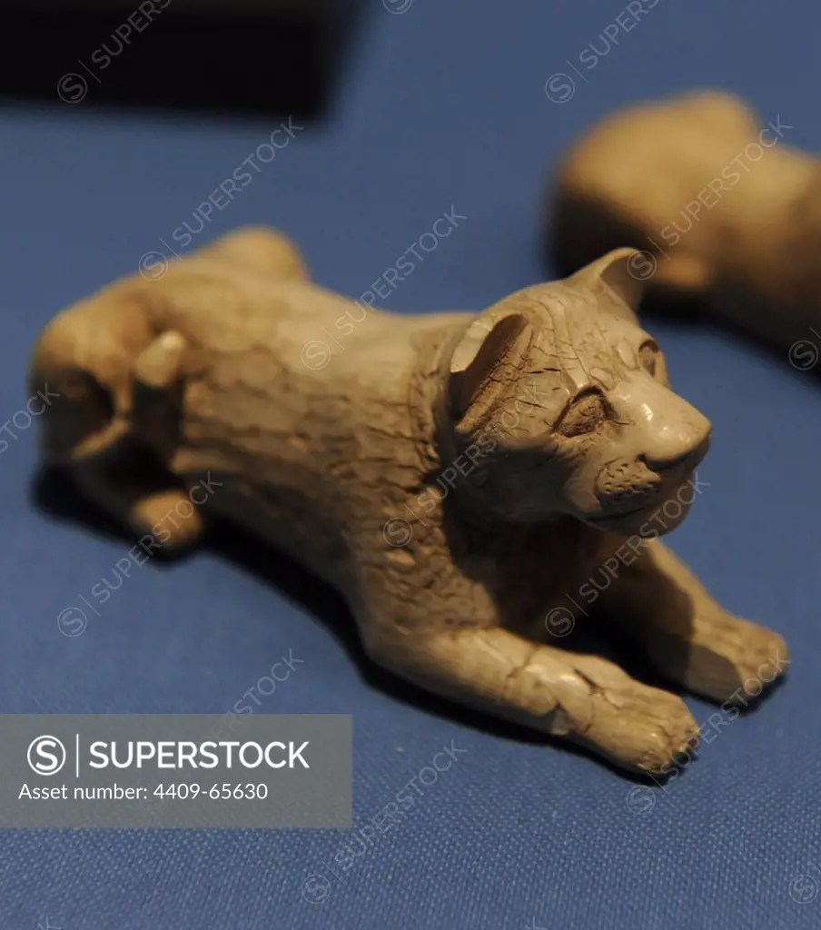 Game piece of ivory in lion-shaped. Found in a tombs in Abydos. 1st Dynasty. Early Dynastic Period. 3000-2890 BC. Ny Carlsberg Glyptotek Museum. Copenhagen. Denmark.