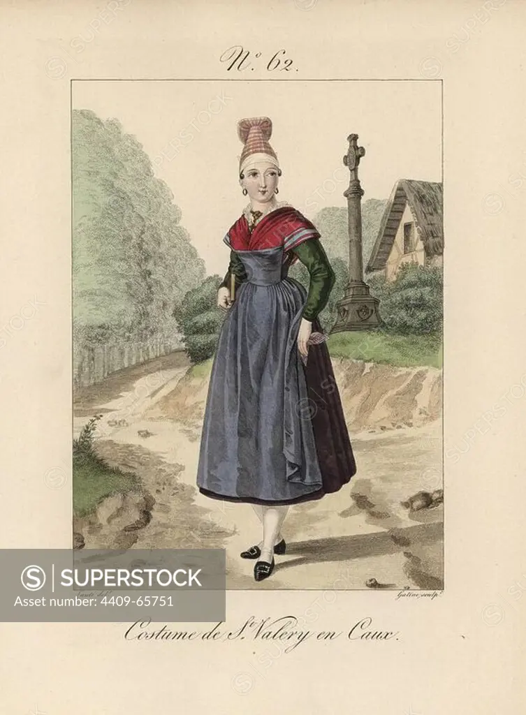 Costume of a woman of St. Valery en Caux. Again the simple bonnet, this time covered with a striped toile. The woman has just left the church, signified by the large cross behind her. Hand-colored fashion plate illustration by Lante engraved by Gatine from Louis-Marie Lante's "Costumes des femmes du Pays de Caux," 1827/1885. With their tall Alsation lace hats, the women of Caux and Normandy were famous for the elegance and style.