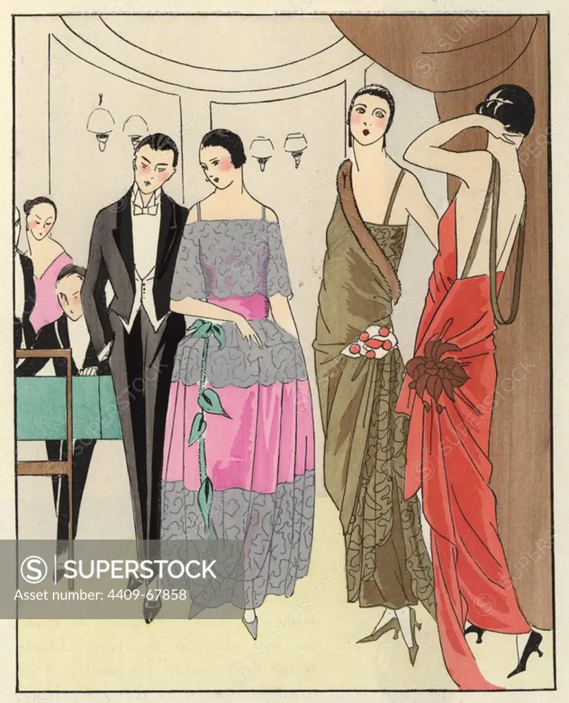 Three elegant women at a party wearing dresses of old rose crepe satin with silver lace and a green velvet belt; gold Cambodian lame trimmed with fur; and coral red with gold belt. A man plays piano in the background. Handcolored pochoir (stencil) lithograph from the French luxury fashion magazine "Art, Gout, Beaute" 1923.