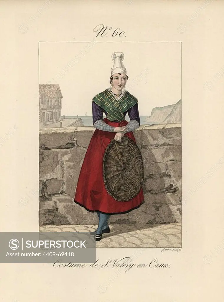 Costume of a fish merchant at St. Valery en Caux. She wears a simple bonnet in toile. The port can be seen in the background. Hand-colored fashion plate illustration by Lante engraved by Gatine from Louis-Marie Lante's "Costumes des femmes du Pays de Caux," 1827/1885. With their tall Alsation lace hats, the women of Caux and Normandy were famous for the elegance and style.