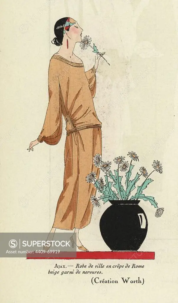 Woman in beige town dress of crepe de Rome, wearing a bandana, and smelling a flower. Handcolored pochoir (stencil) lithograph from the French luxury fashion magazine "Art, Gout, Beaute" 1923.