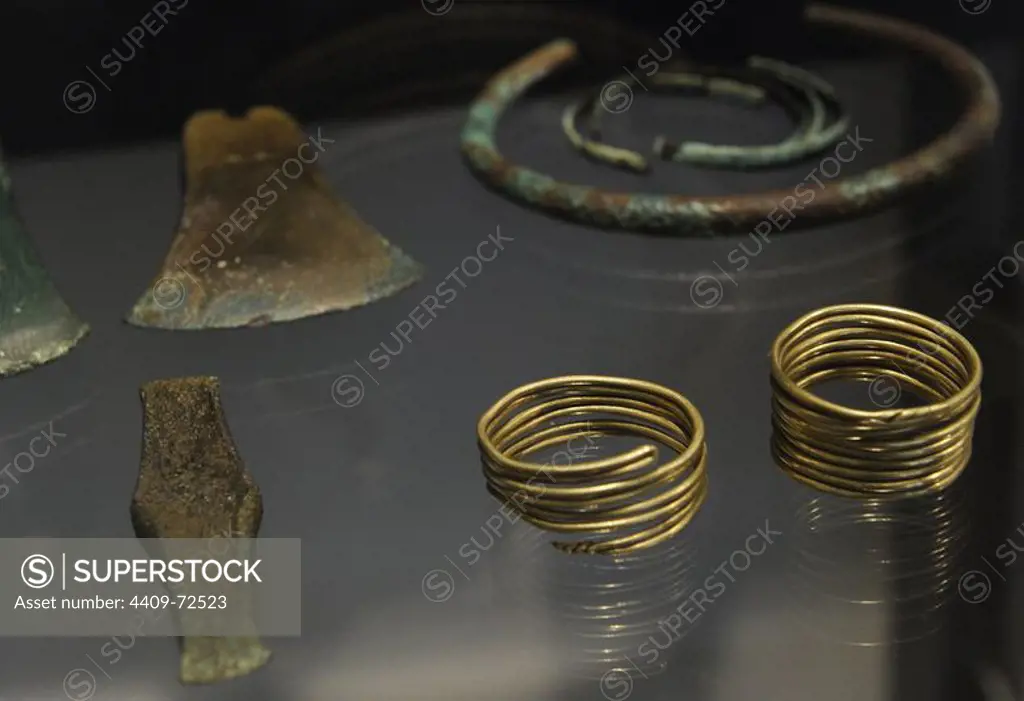 Local made and imported objects from Skeldal, central Jutland. Bracelets, axes and necklaces. 2000-1700 BC. National Museum of Denmark. Copenhagen. Denmark.
