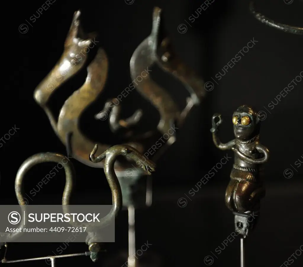 Prehistory. Bronze Age. Several women's ornaments and some bronze figures . Are furnished with pegs. C. 800 BC. Fardal, central Jutland. Denmark. Museum of Denmark. Copenhaguen.
