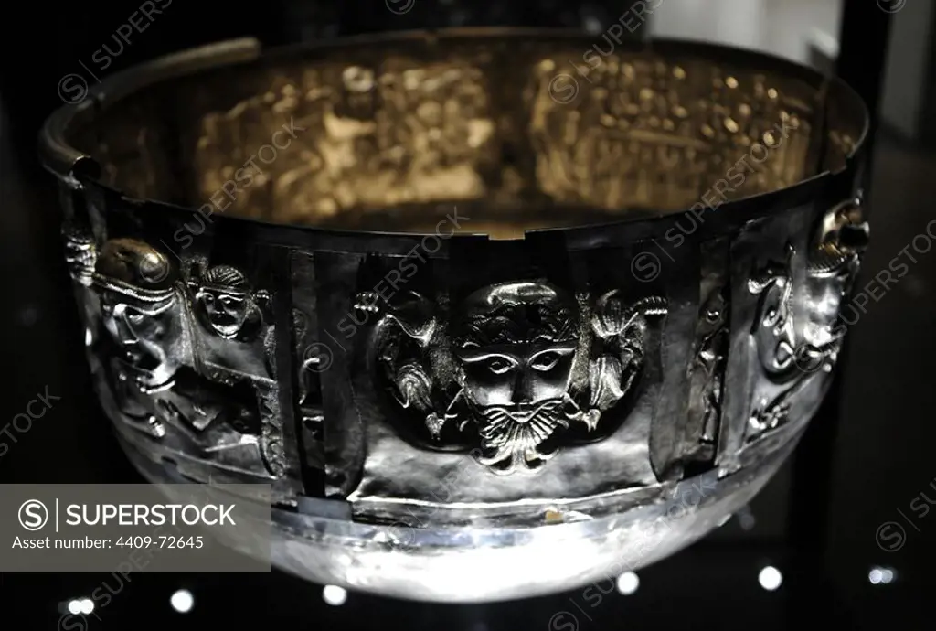 The Gundestrup cauldron. Decorated silver vessel, thought to date between 200 BC and 300 AD, placing it within the late La Te_ne period or early Roman Iron Age. Gundestrup in the Aars parish of Himmerland, Denmark. Male bearded figure holding a pair of deer aloft in each hand, holding them by the hind legs so that they dangle downwards. National Museum of Denmark.