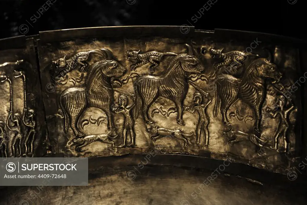 The Gundestrup cauldron. Decorated silver vessel, thought to date between 200 BC and 300 AD, placing it within the late La Te_ne period or early Roman Iron Age. Gundestrup in the Aars parish of Himmerland, Denmark. Ritual sacrifice of three bulls by three men with a sword. Each bull has a dog at its feet and another above its back. National Museum of Denmark.