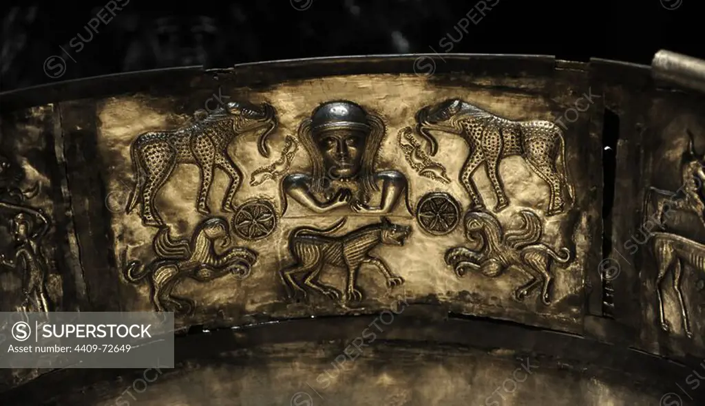 The Gundestrup cauldron. Decorated silver vessel, thought to date between 200 BC and 300 AD, placing it within the late La Te_ne period or early Roman Iron Age. Gundestrup in the Aars parish of Himmerland, Denmark. Goddess flanked by two six-spoked wheels and two elephantine creatures who seem to posses the body and tusks of a wild boar, the hind legs of a bull and the tusk of an elephant. Two griphins and a large hound are also depicted. National Museum of Denmark.