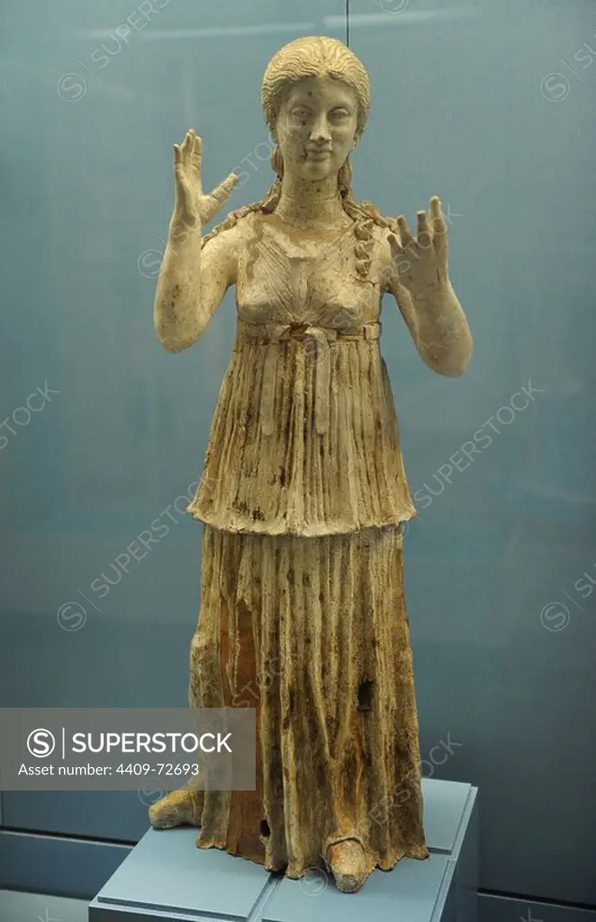 Terracotta figure of young woman with her hands raise in a gesture of mourning. Found in a chamber tomb in Canosa in Apulia with rich gifts, and several similar figures. 300-250 BC. Italy.