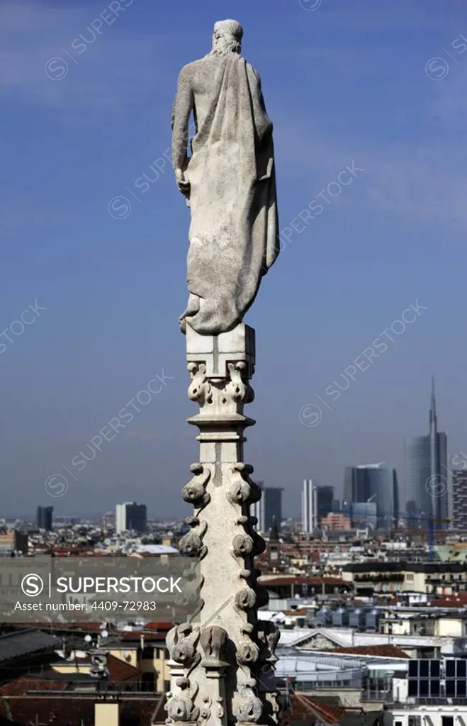Italy. Milan. Cathedral. Gothic. 14th century. Exterior. Statues decorate pinnacle. Facade.