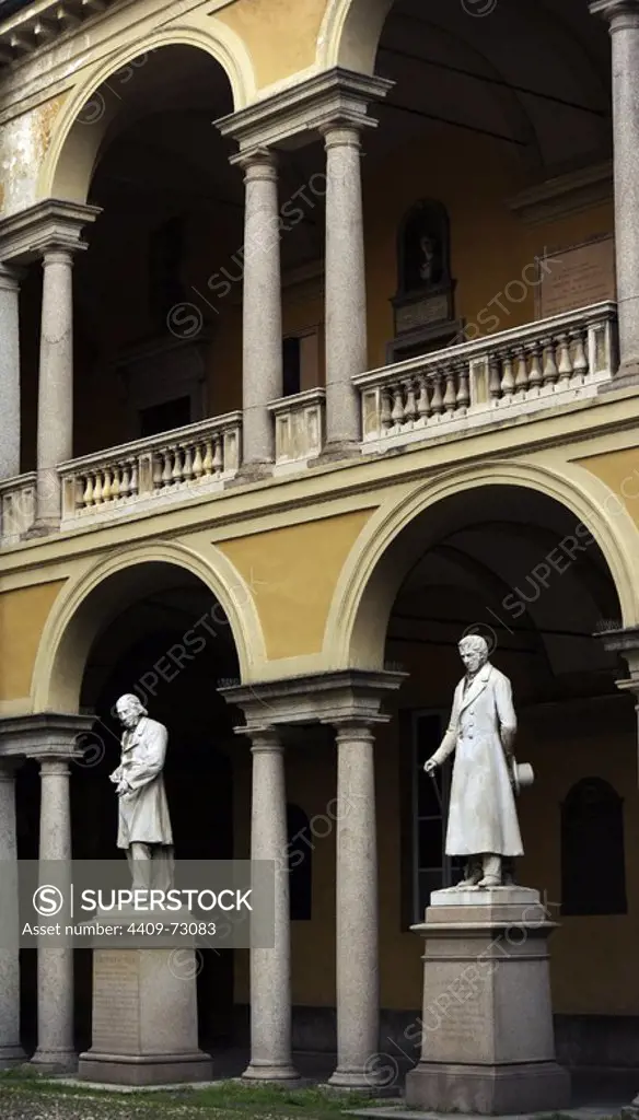 Italy. Pavia. Courtyard in University of Pavia. From left to right, statues: Luigi Porta Pavese (1800-1875) and Antonio Maria Bordoni (1789-1860).