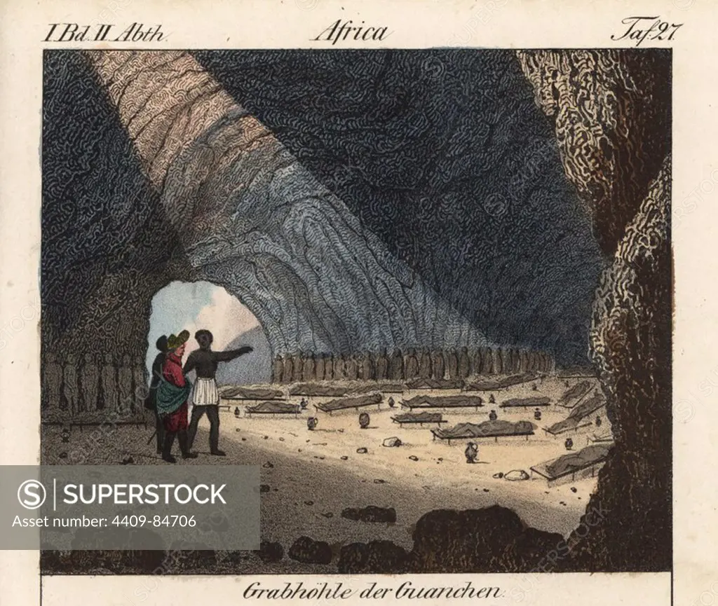 Sepulchral cave with mummies of the Guanche (aboriginal Berber) people on the Canary Islands. Handcoloured lithograph from Friedrich Wilhelm Goedsche's "Vollstaendige Völkergallerie in getreuen Abbildungen" (Complete Gallery of Peoples in True Pictures), Meissen, circa 1835-1840. Goedsche (1785-1863) was a German writer, bookseller and publisher in Meissen. Many of the illustrations were adapted from Bertuch's "Bilderbuch fur Kinder" and others.