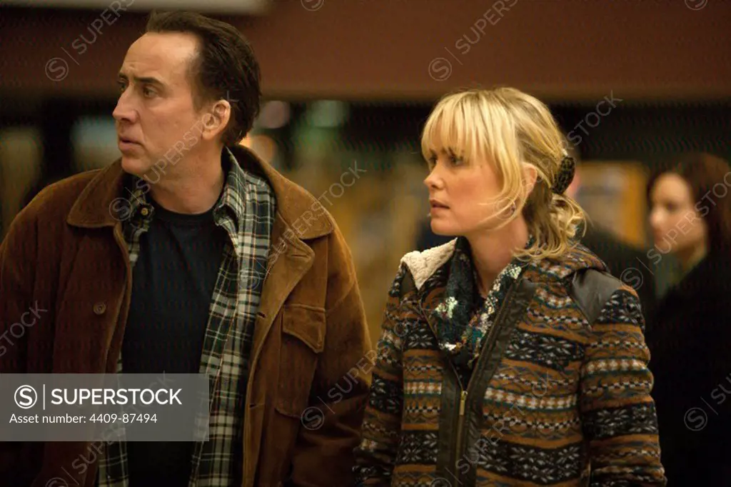 RADHA MITCHELL and NICOLAS CAGE in THE FROZEN GROUND (2013), directed by SCOTT WALKER. Copyright: Editorial use only. No merchandising or book covers. This is a publicly distributed handout. Access rights only, no license of copyright provided. Only to be reproduced in conjunction with promotion of this film.