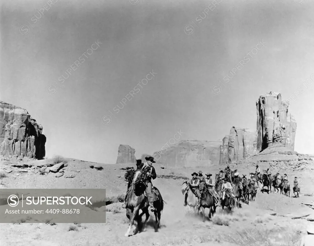 JOHN WAYNE in THE SEARCHERS (1956), directed by JOHN FORD.