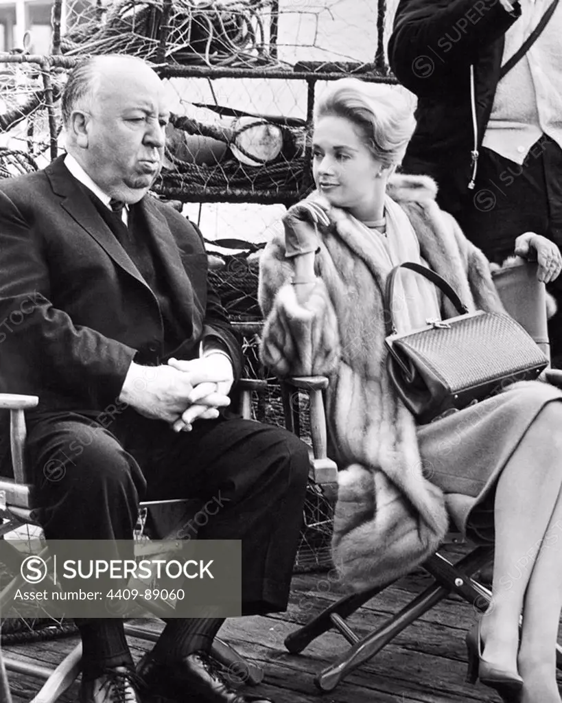 TIPPI HEDREN and ALFRED HITCHCOCK in THE BIRDS (1963), directed by ALFRED HITCHCOCK.