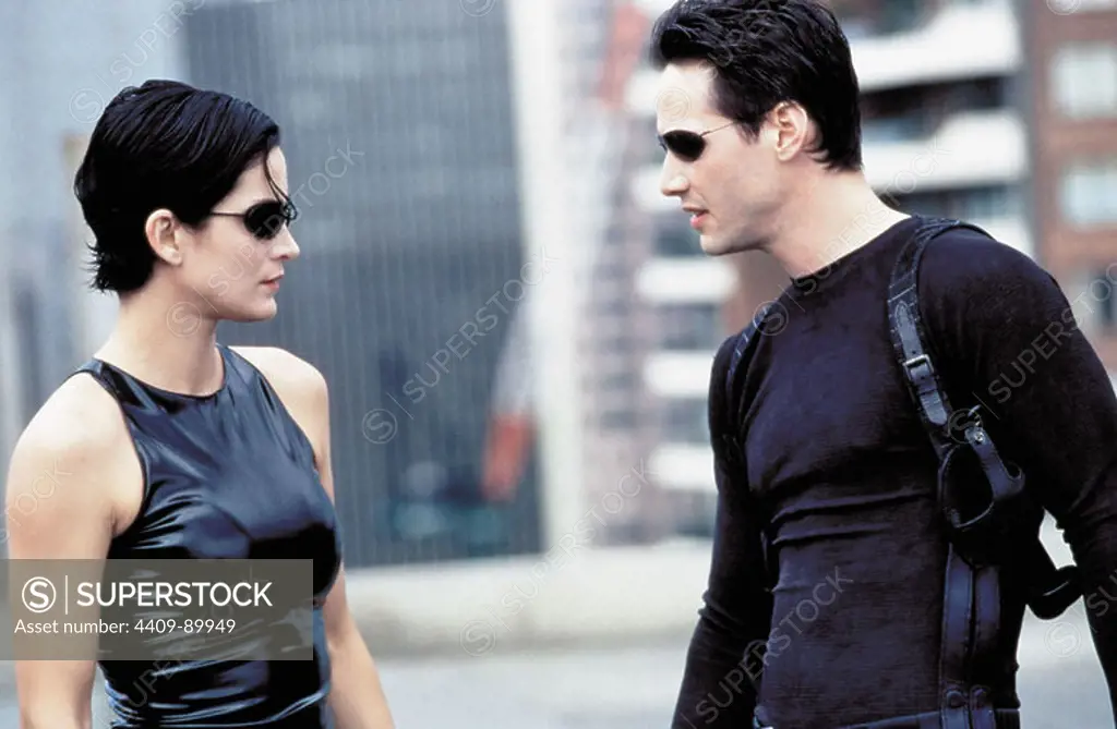 KEANU REEVES and CARRIE-ANNE MOSS in THE MATRIX (1999), directed by ANDY WACHOWSKI and LARRY WACHOWSKI.