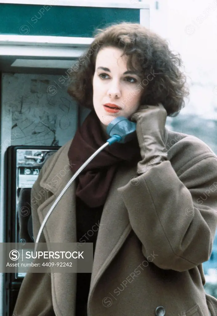 ELIZABETH PERKINS in LOVE AT LARGE (1990), directed by ALAN RUDOLPH.