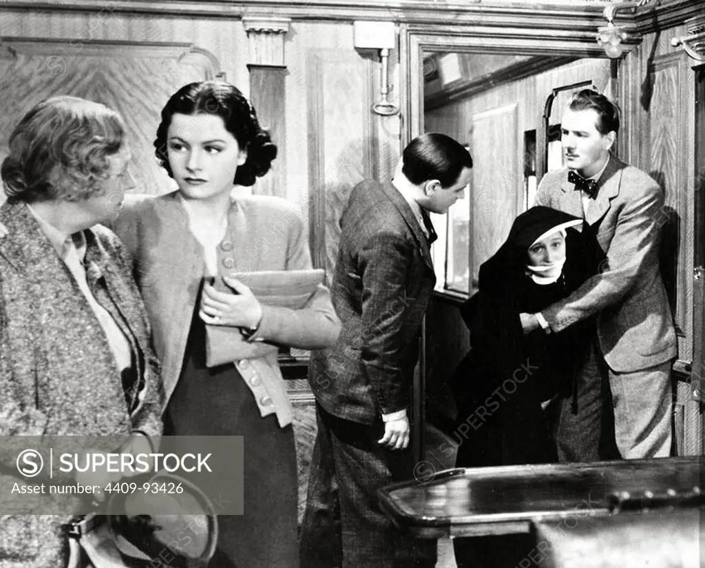 MICHAEL REDGRAVE, DAME MAY WHITTY and MARGARET LOCKWOOD in THE LADY VANISHES (1938), directed by ALFRED HITCHCOCK.