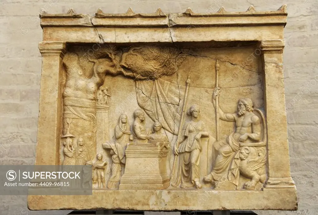 Greek art. Munich Votive Relief. About 200 BC. In a idyllic landscape a family about to make a sacrifice approaches the god, seated on a throne, and his companion. Glyptothek. Munich. Germany.