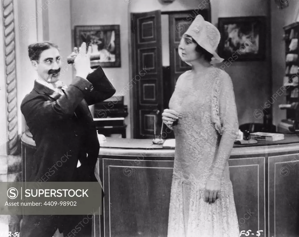 GROUCHO MARX and MARGARET DUMONT in THE COCOANUTS (1929), directed by ROBERT FLOREY.