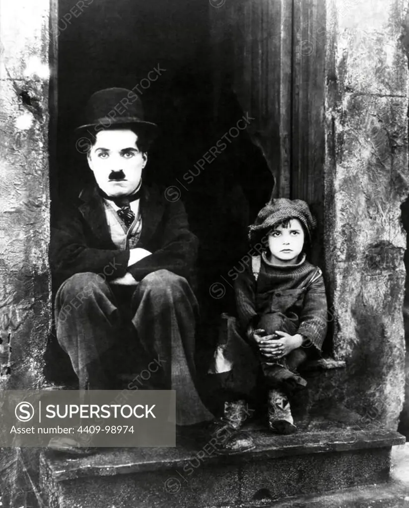 CHARLIE CHAPLIN and JACKIE COOGAN in THE KID (1921), directed by CHARLIE CHAPLIN.