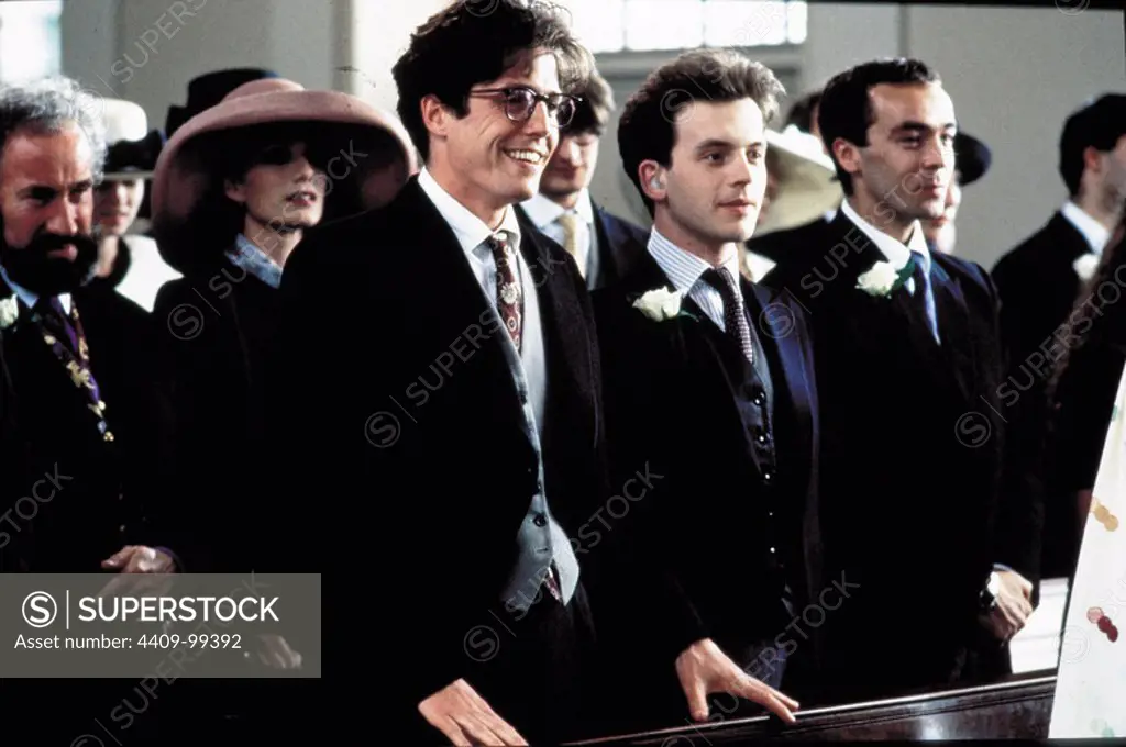 HUGH GRANT, KRISTIN SCOTT THOMAS, JOHN HANNAH, DAVID BOWER and SIMON CALLOW in FOUR WEDDINGS AND A FUNERAL (1994), directed by MIKE NEWELL.