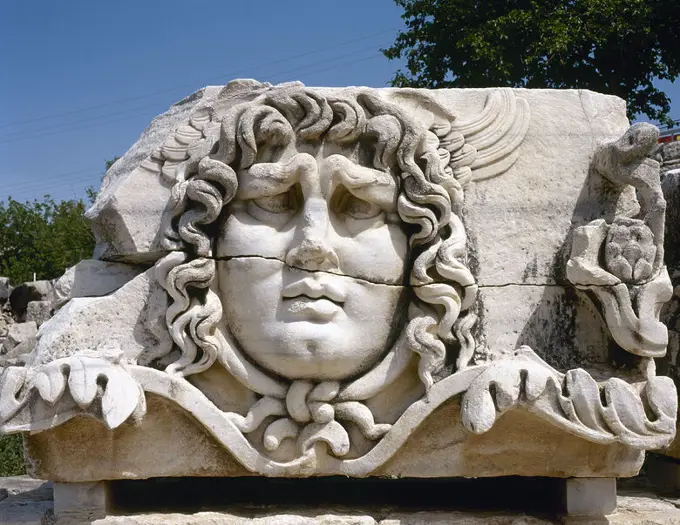 A stone-carved Madusa head. The most frightening of the three Gorgons.Turn to stone all who looked and, after her death, her head kept this power. Temple of Apollo. Didyma. Turkey.