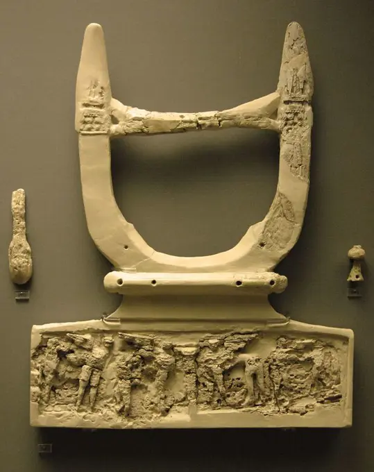 Mycenaean art. Llyre of ivory with decorative carvings at the base that was the sound box. National Archaeological Museum. Athens. Greece.