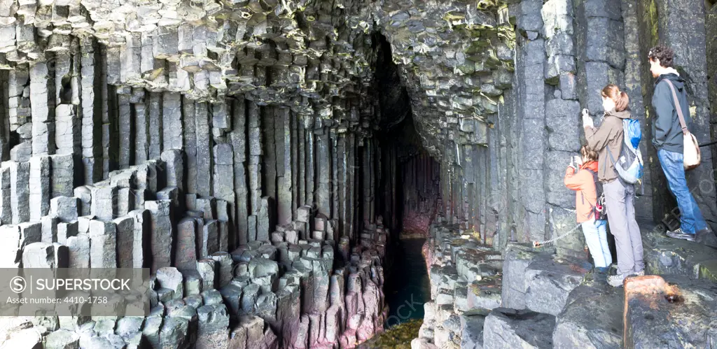 Tourists at the entrance to Fingal's Cave, Isle of Staffa, Isle of Mull, Inner Hebrides, Scotland