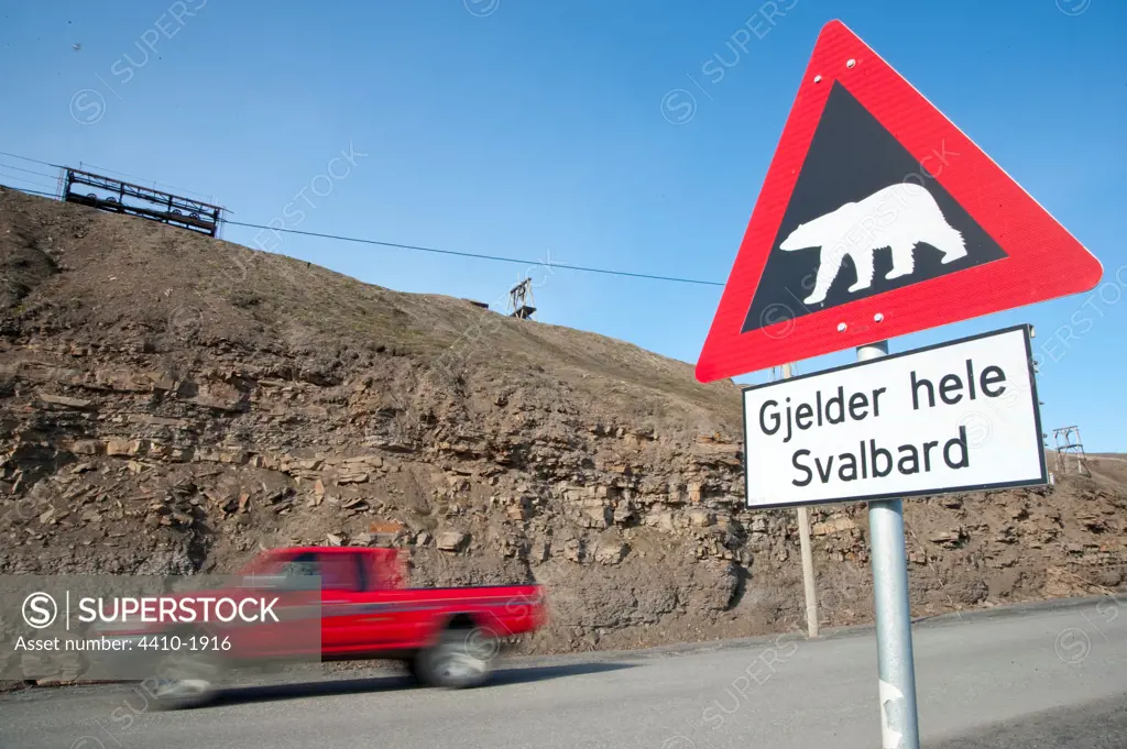 Polar bear warning road sign on outskirts of Longyearbyen, Spitsbergen, Svalbard Islands, Norway
