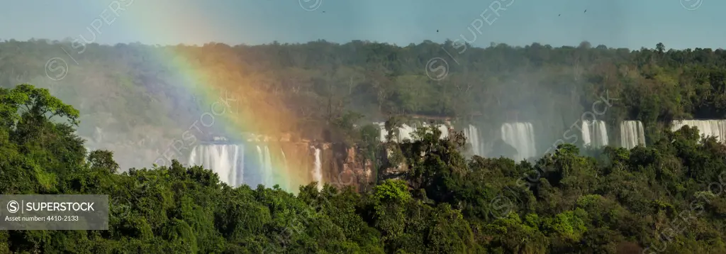 Brasil, State of Parana, Rainbow over Iguasu Falls on Iguasu River photographed from Brazilian side of Falls