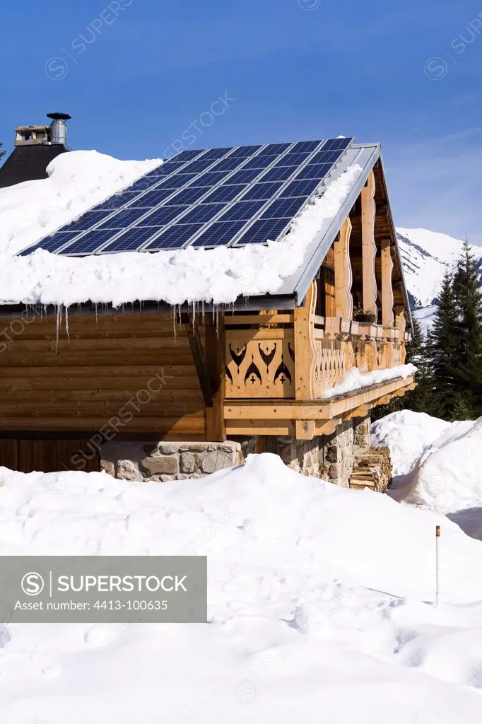 Photovoltaic cells on a cabin roof in winter