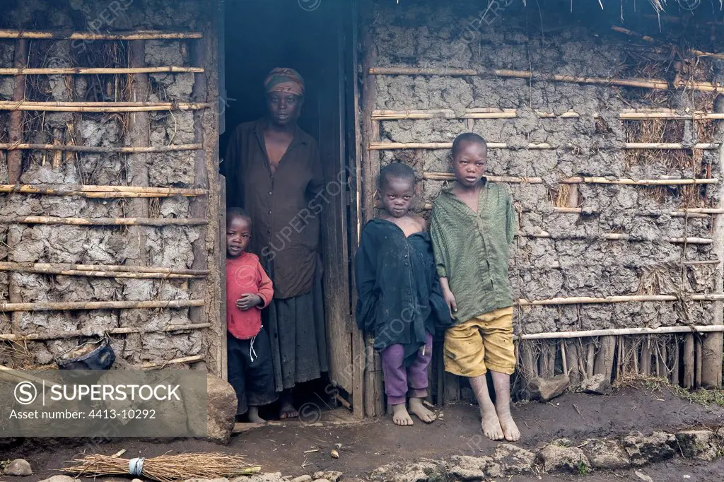 Inhabitants in front of their box close to the park Rwanda
