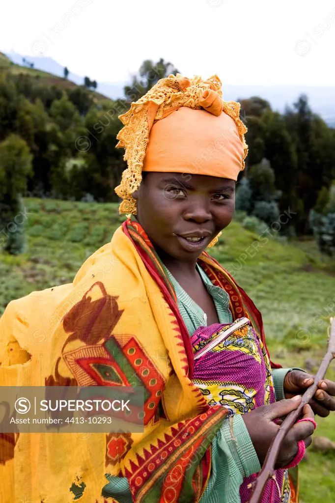 Country-woman in traditional costume close to the park of the volcanos