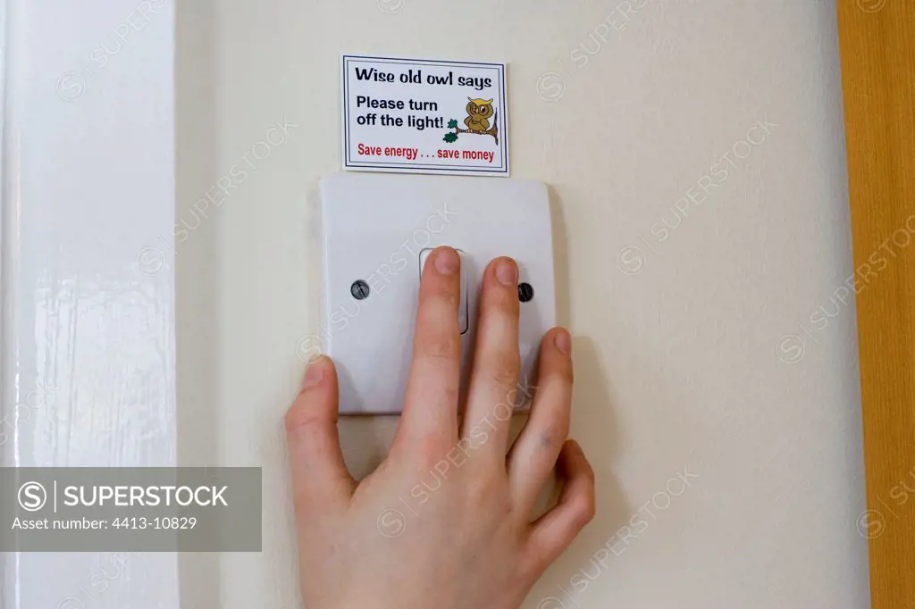 Energy saving sticker above light switch