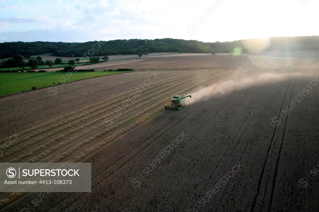 Aerial view of a combine harvester in a field