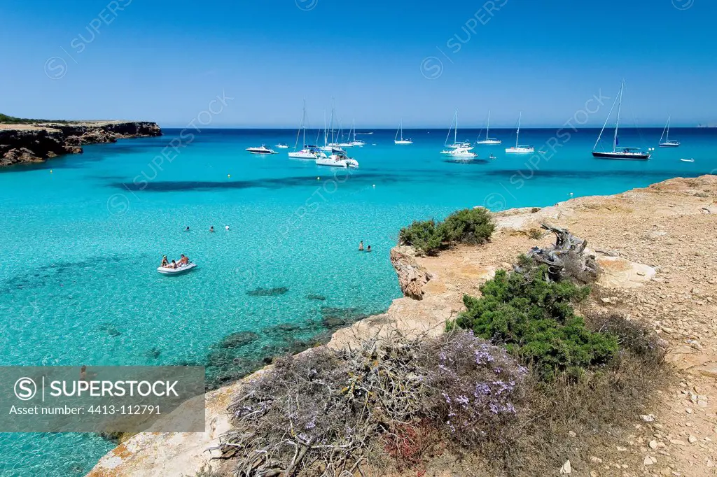 Rocky shore and boats Balearic Formentera Cala Saona