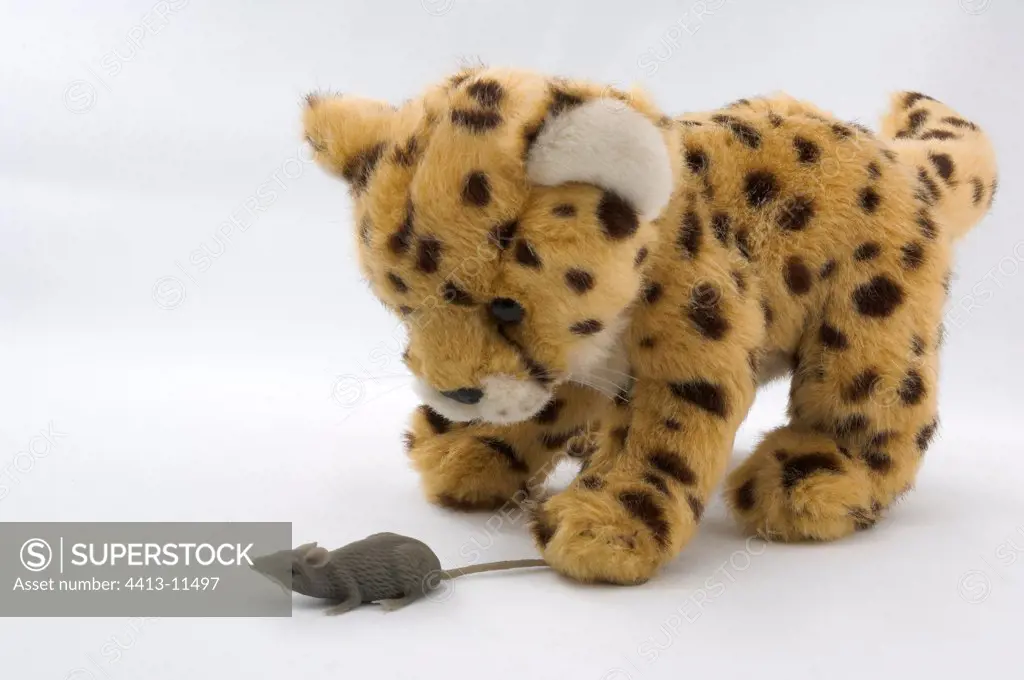 Stuffed Cheetah playing with a plastic mouse