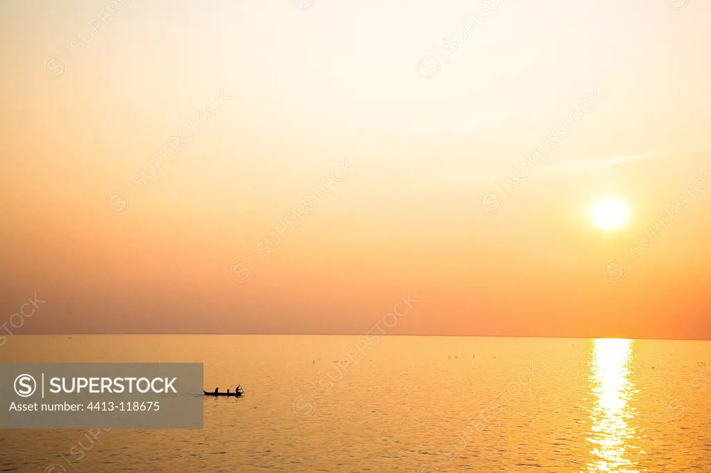 Boat and sunset on Lake Tonle Sap Cambodia