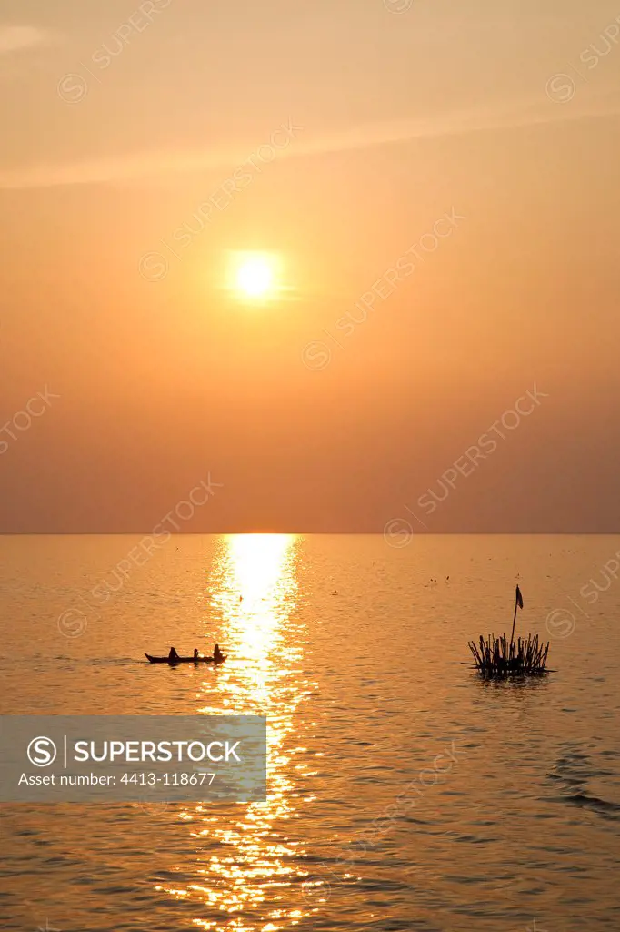 Fisherman under his traps on Lake Tonle Sap Cambodia